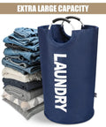Big Ol 95L Large Collapsible Laundry Basket with freestanding tall hamper, dark blue, next to folded clothes pile.