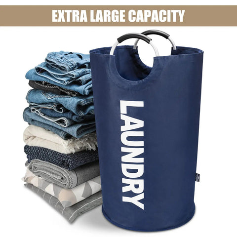 Big Ol 95L Large Collapsible Laundry Basket with freestanding tall hamper, dark blue, next to folded clothes pile.