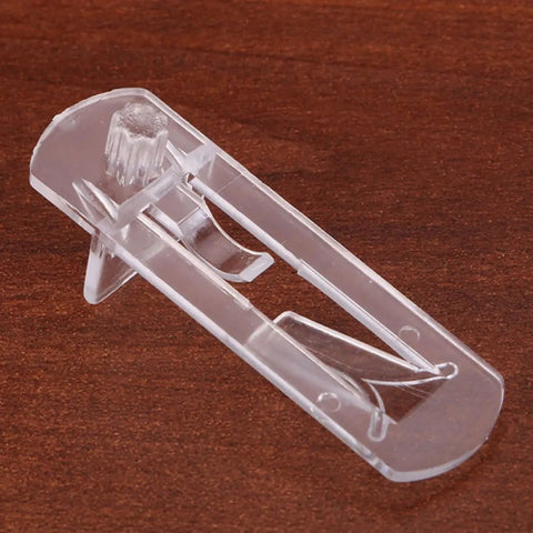 Close-up of clear plastic Easy Locking Shelf Pegs For Cabinets And Furniture No Burrs Required Durable Shelf Pins on wooden surface