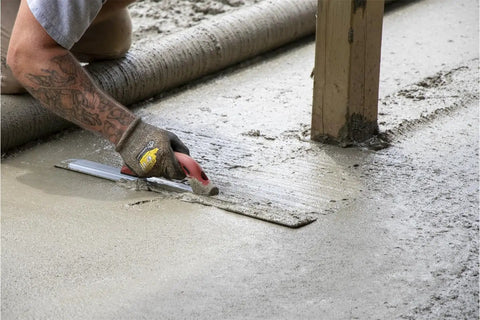 Worker using 24 Inch Beveled End Magnesium Hand Float With DuraSoft Handle And Cast Magnesium Blade For Slick, Pro Level Concrete Finishes