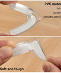 Tough As Nails L Shaped Corner Protectors Shielding Sharp Furniture Edges With Heavy Duty Self Sticking Tape For Kid Proof Home Safety And Baby Guard Covers in transparent PVC material.