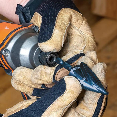 Heavy Duty Step Drill Bit With Quick Release Spiral Flutes And Hex Shank held in hand, showing detailed grip and design for easy metal cutting.