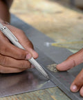 Solid Heavy Duty Tungsten Carbide Scriber With Retractable Clip Etching Pen Marks Glass Metal Ceramic Marble Works Like A Champ Giving Bangin Lines Daily Premium Grip Knurled Handle For Ultimate Control in use on metal.
