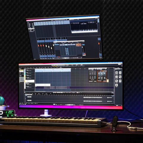 Dual monitors with music software, keyboard below, surrounded by 4 Pack 48 By 24 By 2 Inches Acoustic Panels Egg Crate Foam Soundproof Panels for walls.