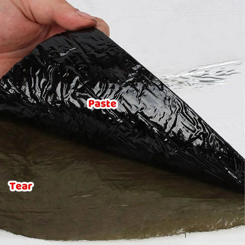 Heavy Duty Asphalt Roofing Tape That Kicks Leaks To The Curb With Heat Reflective Aluminum Foil on hand, showing black adhesive layer.