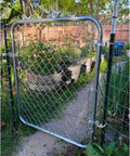 Heavy Duty T Post Gate Hinge Pins Built Tough With Rust Resistant Steel Farm Grade Target Hangers For Fence And Backyard Gates No Hassle Prep Comes With Every Bolt visible on a garden gate with chain link design.