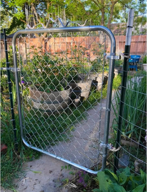 Heavy Duty T Post Gate Hinge Pins Built Tough With Rust Resistant Steel Farm Grade Target Hangers For Fence And Backyard Gates No Hassle Prep Comes With Every Bolt visible on a garden gate with chain link design.