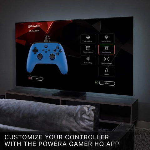 Officially Licensed Symmetric Wired Xbox Controller in Blue for Series X and S displayed on TV with customization options.