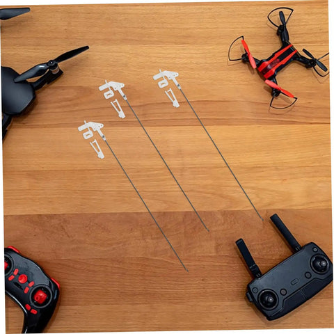 20 Pack Heavy Duty Metal RC Airplane Linkage Stoppers Plus Adjustable Push Rod Connectors For Fixed Wing Models Quick Swaps DIY Mods Rock Solid Flyin Gear on wooden surface with drones and remotes.