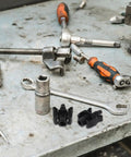 Heavy Duty 2 Pack Heater Hose Connector Plug And Play Fitting For Radiator Coolant Outlet and Auxiliary Water Tank on a cluttered workbench.