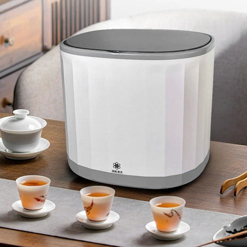Compact Countertop Dishwasher With 4 Liter Built In Tank And 360 Rotating Spray Head Usb Rechargeable Portable Cleaner For Rv Camping Dorms Tiny Homes No Sweat Quick Rinse Easy Peasy Setup Weekend Warrior Approved on a wooden table with tea cups.