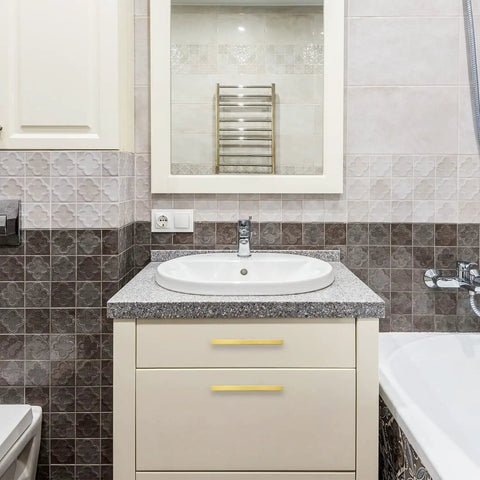 Bathroom vanity with 30 Pack 7 3 Eighths Inch Square Cabinet Pulls in Brushed Brass Stainless Steel, shown on drawers