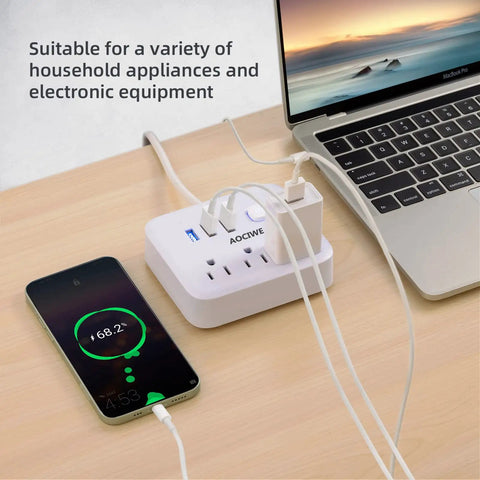 Power Strip Surge Protector With USB Charging Station on desk, connected to laptop and phone, showing anti skid pad feature.