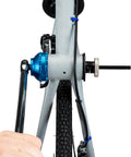 Bottom Bracket Retaining System With Double Sided Adapter Nut For Cartridge BBs in use on bike frame, black finish, spring loaded