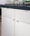 Lincoln Collection 1 5/16-Inch Center-To-Center White Modern Cabinet And Drawer Edge Pull Handle installed on kitchen cabinet