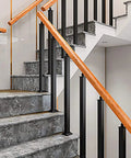 Top Shelf Square Wrought Iron Baluster Posts Built Like A Tank Black Powder Coated Banister Rails For Outdoor Deck And Staircase Project 4 Pack 39 Inch Height Smooth Finish Railing Kit on a staircase with wooden handrail.