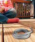 Flexible EPDM Concrete Expansion Joint Filler For Driveways And Cracks Weather Resistant Rubber Strip Repair Replacement Joint 1 Inch Wide 15 Feet Long Cut To Fit For Easy DIY Fix visible on wooden deck.