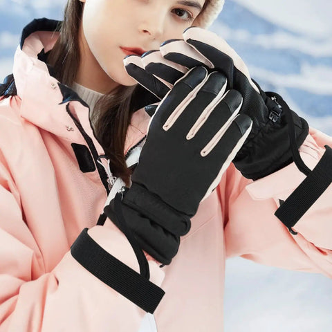 Person wearing 4 Pack Winter Ski Gloves With Elastic Wrist Straps For Men, No Slip Secure Fit Snowboarding Gear outdoors.