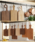 Slick Clear Acrylic Charcuterie Board Templates Kit With Three Woodworking Pens displayed with wooden boards hanging in kitchen.