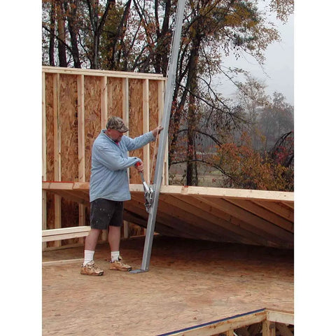 Tranzporter wall jack, 16 ft, steel, side view with worker and wooden wall frame