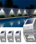 4 Pack Solar Wall Lights Outdoor Stainless Steel Motion Sensor Lamps Waterproof No Fuss Easy Install for Fence Deck Post Stair Front Porch Dock Patio Yard House Siding Security Lighting shown by poolside.