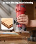 Beefy 630W Wood Router Tool With Fixed Base, Compact Design in use for edge trimming on wood, showing detail of slotting.