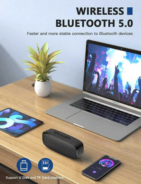 Bluetooth Speaker Portable Wireless Speaker With Loud Stereo Sound And Rich Bass, 12 Hour Playtime on a desk with devices