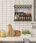 Large Capacity K Cup Holder And Coffee Pod Organizer For Home Office And Kitchen Counter Storage Holds 28 Pods On Top Plus Space For Extra Cups And Accessories displayed on a kitchen counter with spice jars below.