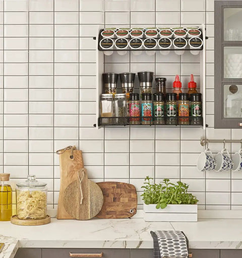 Large Capacity K Cup Holder And Coffee Pod Organizer For Home Office And Kitchen Counter Storage Holds 28 Pods On Top Plus Space For Extra Cups And Accessories displayed on a kitchen counter with spice jars below.