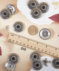 Knockout Vintage Screw Back Buttons 30mm Round Conchos Black Artificial Turquoise on a flat surface with ruler and coin.