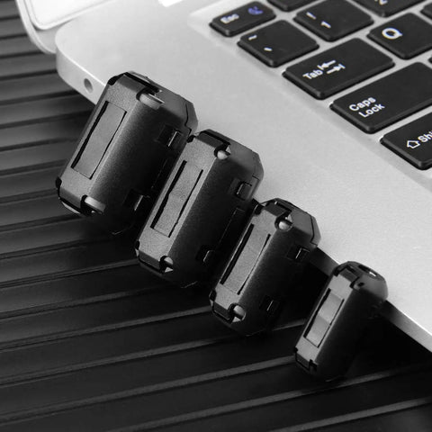 20 Pack Ferrite Ring Core EMI RFI Noise Suppressor Clips for cables, 4 size set with black plastic cover shown on laptop keyboard