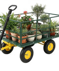 Heavy Duty 4 In 1 Steel Garden Cart Workhorse with 1500 lb capacity, 13-inch all-terrain wheels, dark green frame, yellow hubs loaded with plants.