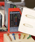 Auto Jig Pocket Hole Jig System Starter Pack with drill bits and pocket hole wood sample for precise woodworking joinery.