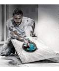 Heavy Duty Electric Vacuum Suction Cup Lifter Handles Porcelain Tile Granite And Glass With Rock Solid Grip And Quick Release Valve For No Sweat Wall Installations, used by worker on large tile.