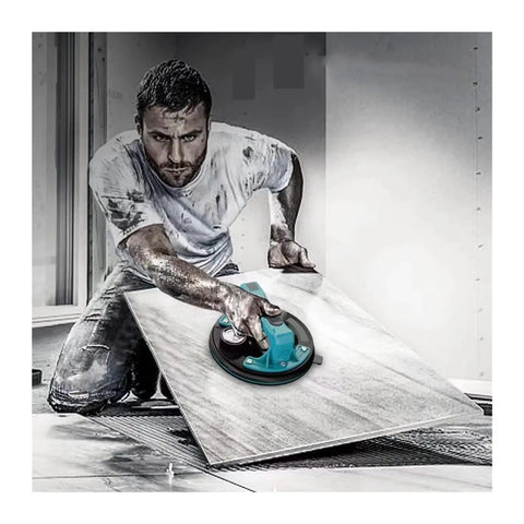 Heavy Duty Electric Vacuum Suction Cup Lifter Handles Porcelain Tile Granite And Glass With Rock Solid Grip And Quick Release Valve For No Sweat Wall Installations, used by worker on large tile.