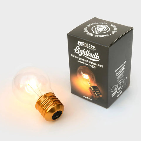 Cordless USB Rechargeable LED Light Bulb Lamp With Vintage Edison Glow beside box, showcasing amber filament design.