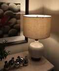 LED A19 Light Bulb 60W Equivalent Dimmable, 810 Lumens lighting up a bedroom lamp with soft white, energy-saving glow