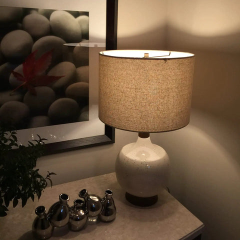 LED A19 Light Bulb 60W Equivalent Dimmable, 810 Lumens lighting up a bedroom lamp with soft white, energy-saving glow