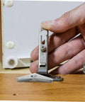 Installing 12-Piece Galvanized Iron Toggle Bolts With Wings For Drywall And Hollow Walls with hand demonstrating secure mounting