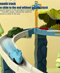 Epic Toy Car Ramp Track Set With Railcar Slot Cars And 20 Mini Cars in forest scene featuring dinosaur, smooth ramp track in view.