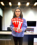 Woman holding Four Pack Fire Extinguisher Signs For Office And Warehouse Safety, Durable 80 Mil Thick Plastic, OSHA Compliant