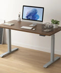 Stylish Grey Dual Motor Electric Standing Desk Frame With Built In Usb A Plus C Charging Ports Smooth Height Adjustable Sit Stand Base Sturdy Steel Legs For Home Office Workstation Setup Super Easy To Assemble with wooden top and computer setup.