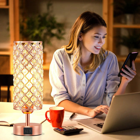 Rose Gold Crystal Table Lamp With 3 Way Dimmable Touch Control And USB C And USB A Ports, beside woman at desk