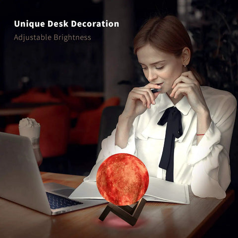 Woman working at desk with Moon Galaxy Lamp Night Light For Kids With 16 Colors 3D LED Moon With Stand Remote And Touch Control