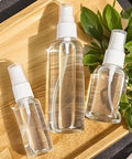 Must Have Travel Spray Bottle Set Clear Plastic Four Pack With Two 1oz And Two 1.7oz Bottles Plus Extra Nozzle Funnel And Labels