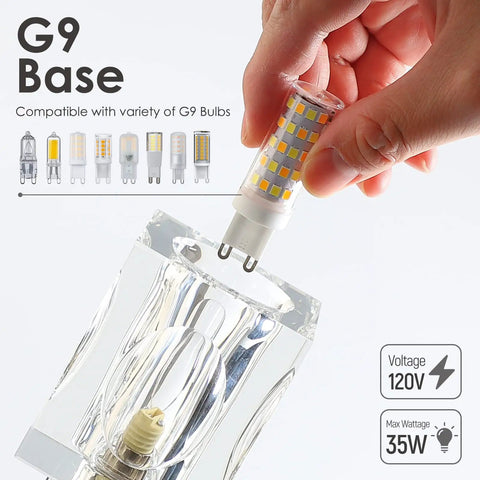 Hand inserting G9 base bulb into Three Light Crystal Vanity Bathroom Light Fixture, 16 Inch Chrome Over Mirror with crystal accents.