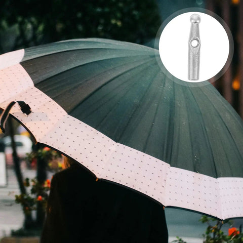 Close-up of 10 Piece Tough As Nails Plastic Umbrella Tail Beads For Easy Rain Gear Repair And Replacement on a black umbrella
