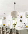 Two Tier Drum Pendant Light With Adjustable Hanging Wire above kitchen island, off white linen shade, modern farmhouse style.