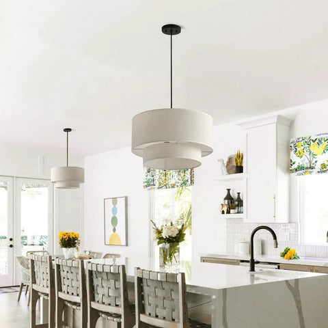 Two Tier Drum Pendant Light With Adjustable Hanging Wire above kitchen island, off white linen shade, modern farmhouse style.
