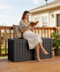 Woman sitting on 90 Gallon Waterproof Deck Box With Lockable Lid For Patio Storage Cushions Pool Gear Garden Tools And Packages Weatherproof Resin Outdoor Storage Bench